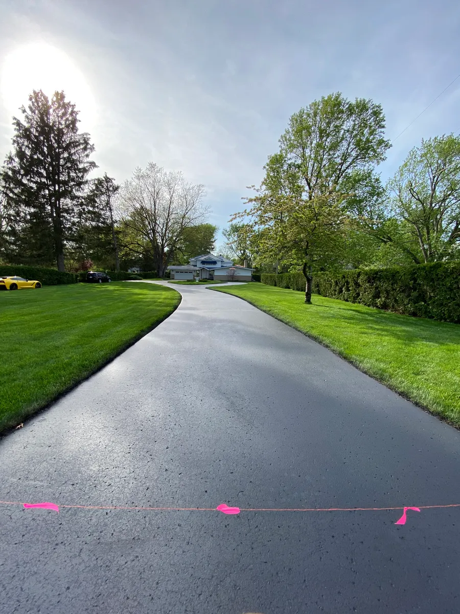 Finished sealcoated driveway by Mason’s Asphalt